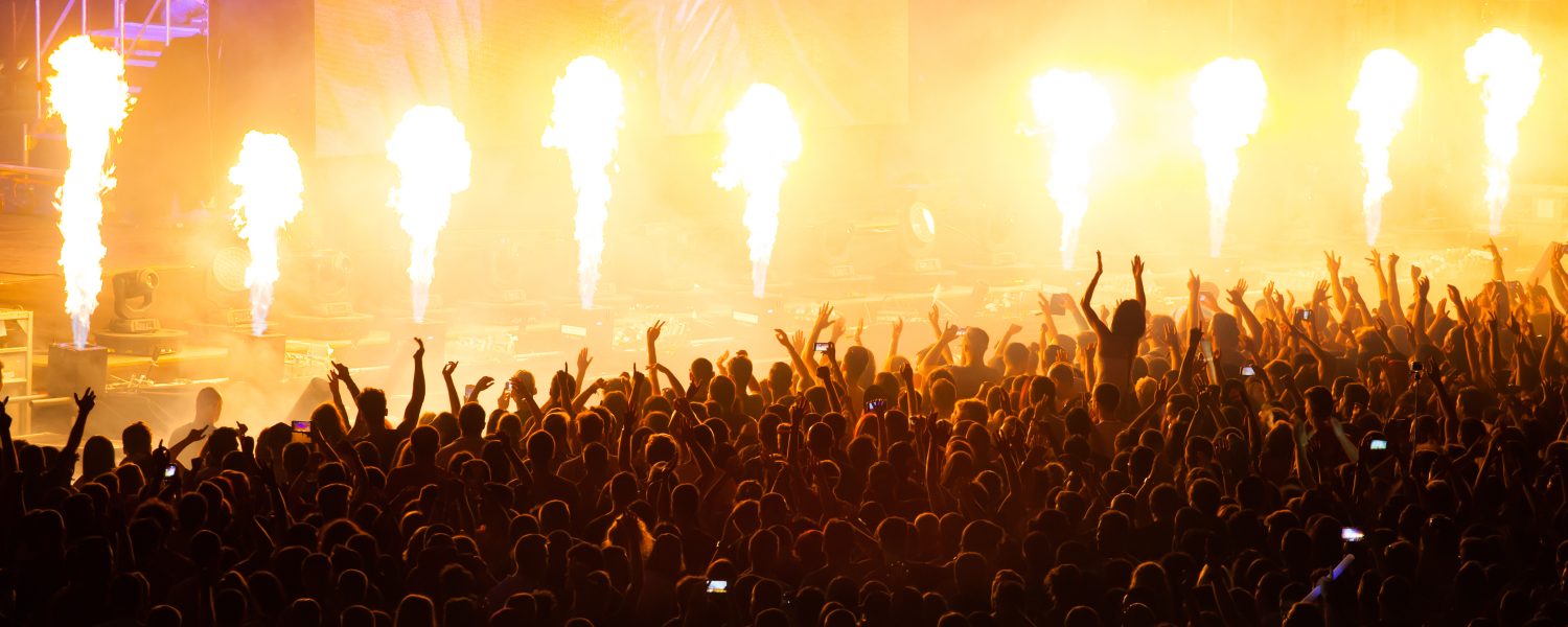 Crowd at concert and blurred stage lights